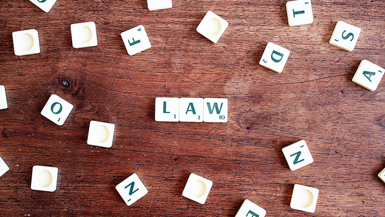 Lawyer reviewing legal documents at a desk